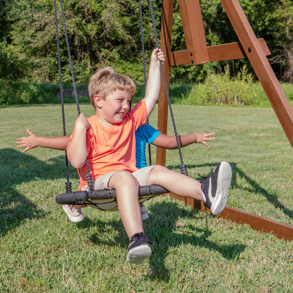 Backyard Discovery Skyfort All Cedar Swing Set, Elevated Covered Wood Roof Clubhouse with Bay Windows, 2 Belt Swings, Web Swing, 10ft Wave Slide, 5 ft Tube Slide, Covered Picnic Table, 5 ft Rock Wall