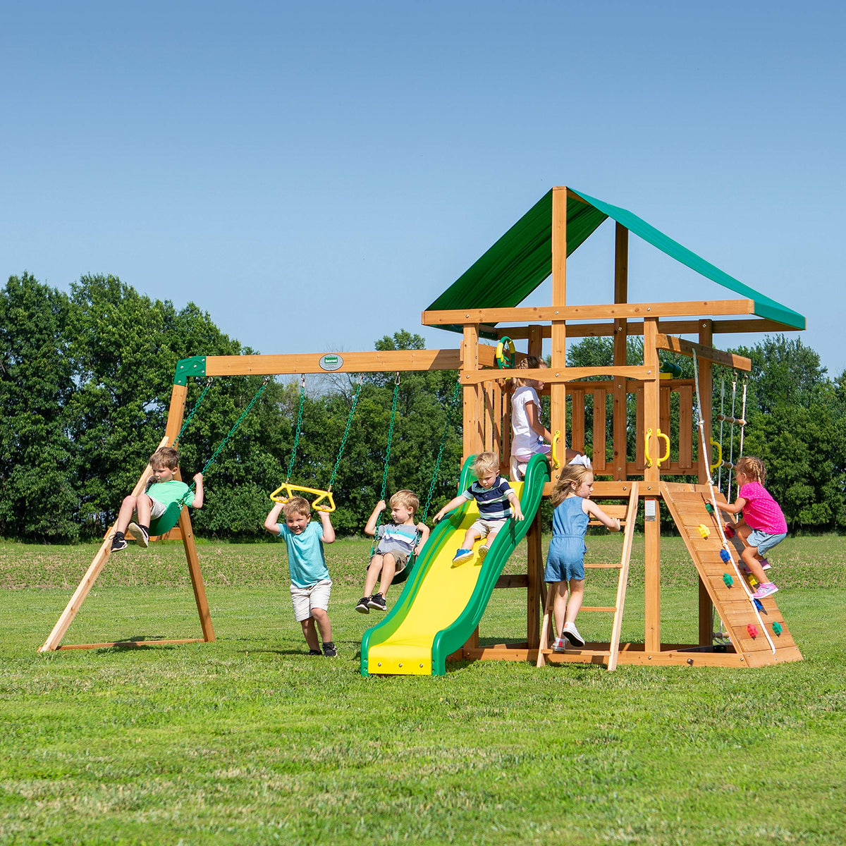 Backyard Discovery Mount Mckinley Cedar Wood Swing Set with Wave Slide, Play Deck, Double Rock Wall, Rope Ladder, Web Swing, Belt Swings, Toy Telescope, Steering Wheel, Sandbox Area, Outdoor Playset